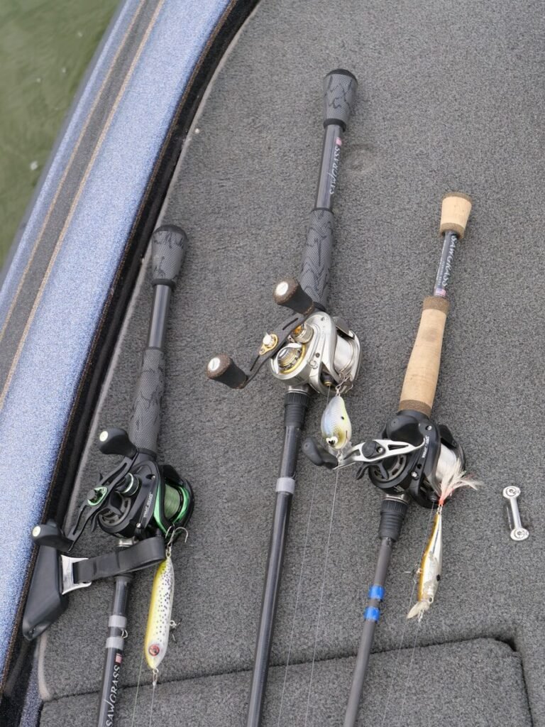 Photo by Richard R a couple of fishing rods sitting on top of a boat